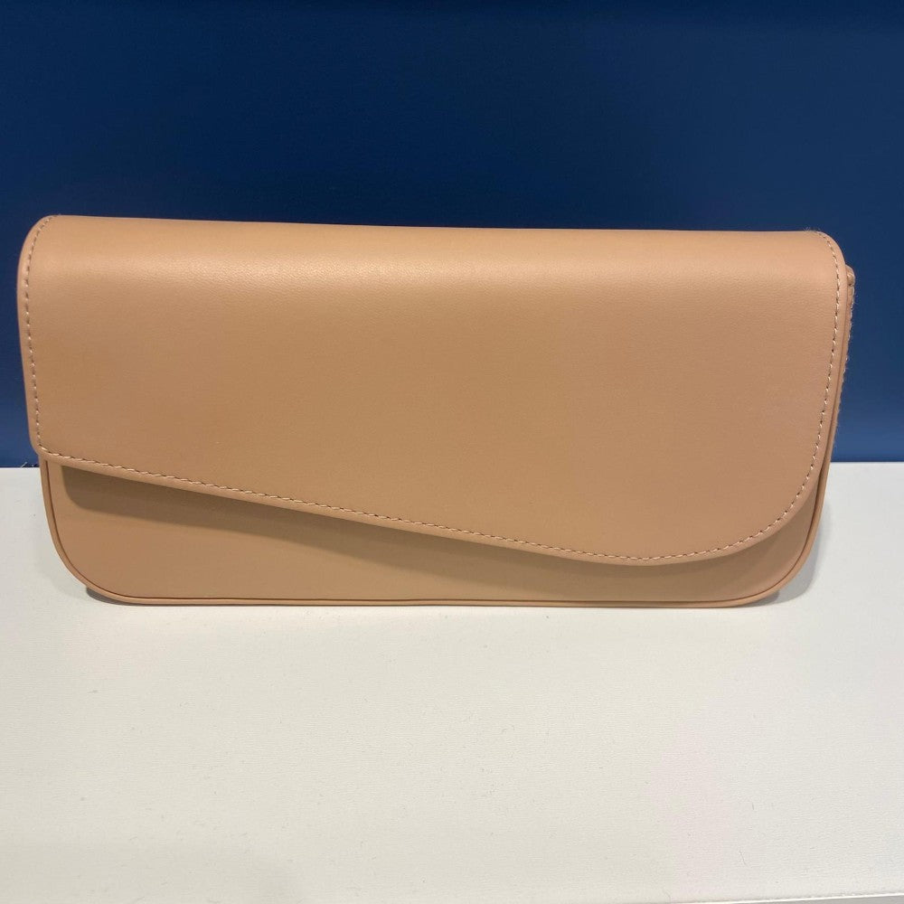 Unisa Beige clutch bag on a white surface with a blue background