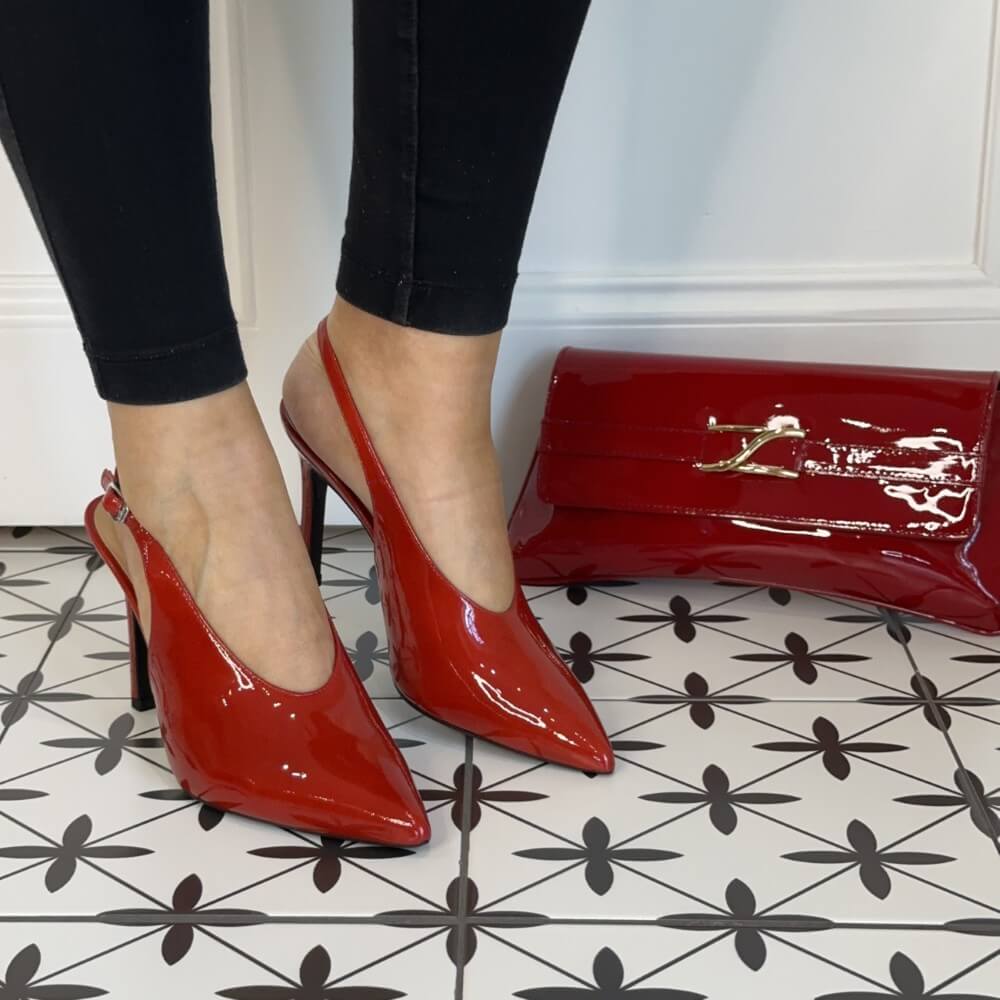 Red high-heeled shoes and a matching red clutch Unisa Tabar Patent Leather Slingback Raspberry Red