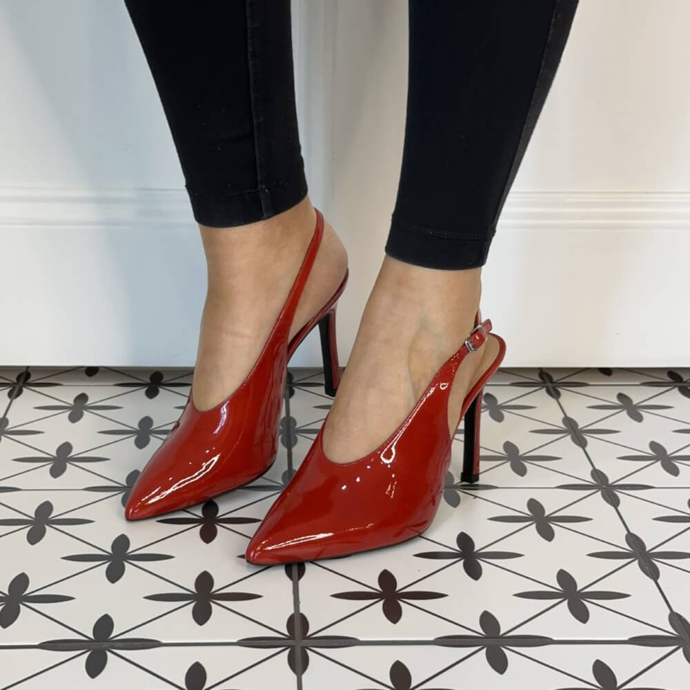Red high-heeled shoes and a matching red clutch Unisa Tabar Patent Leather Slingback Raspberry Red