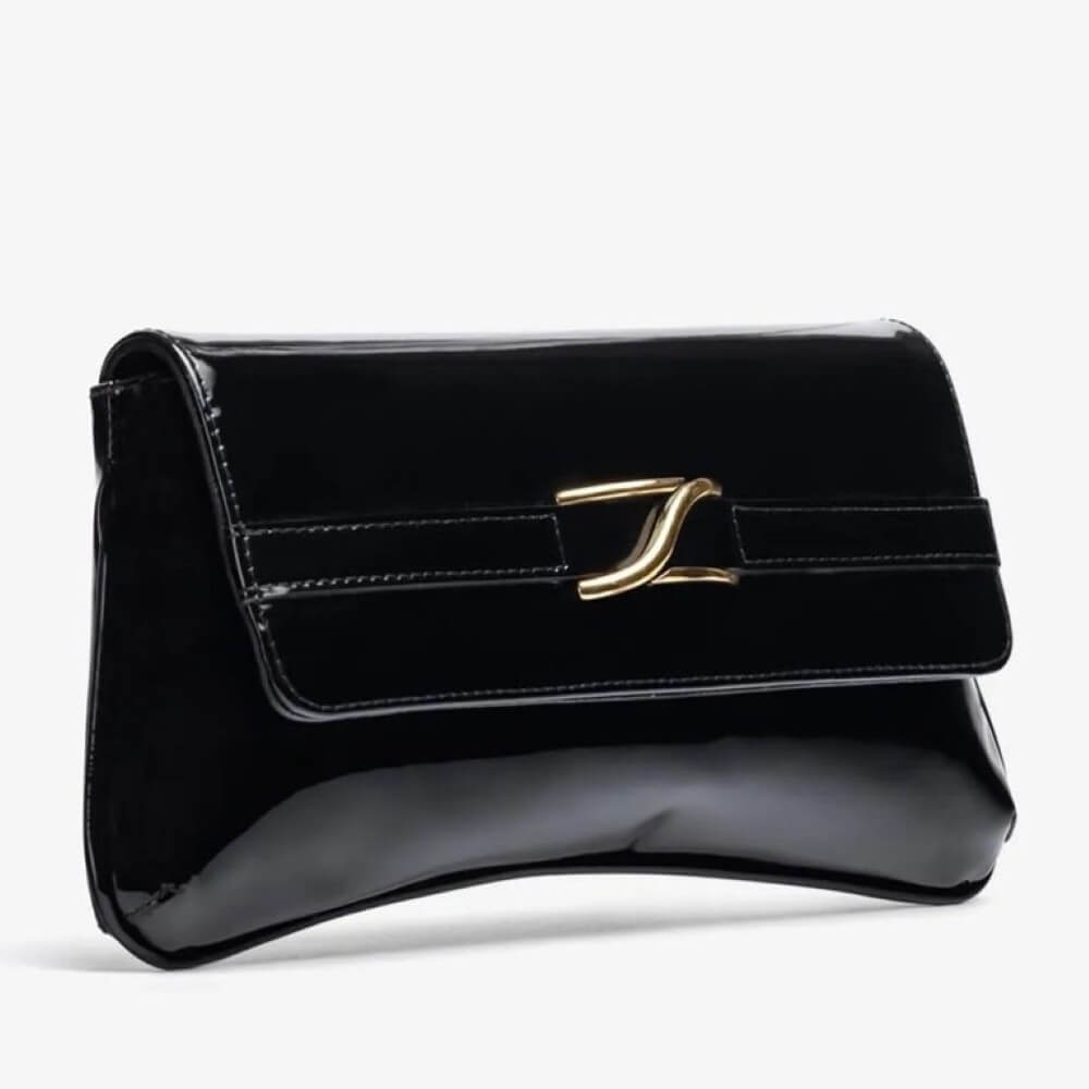 Black patent leather handbag with a gold clasp on a light gray background Unisa ZBlair Black Patent Shoulder Bag