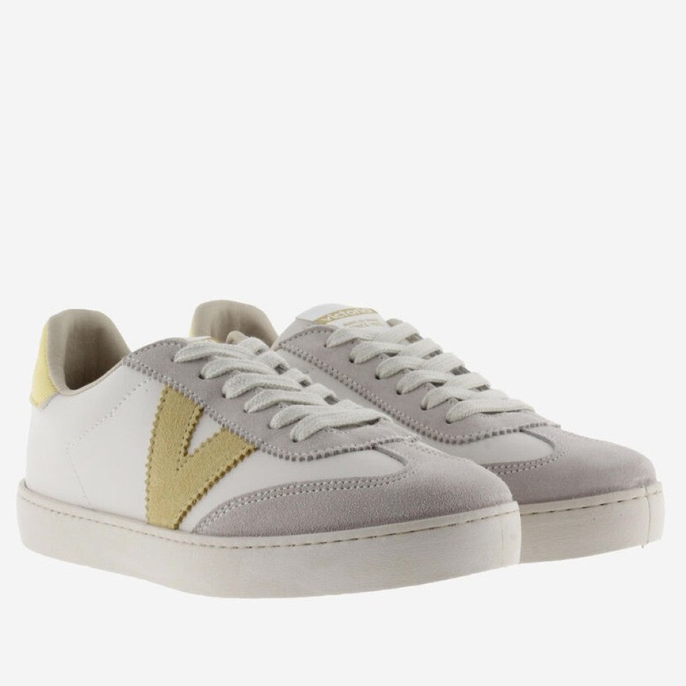 Victoria beige and white sneakers with yellow accents on a white background