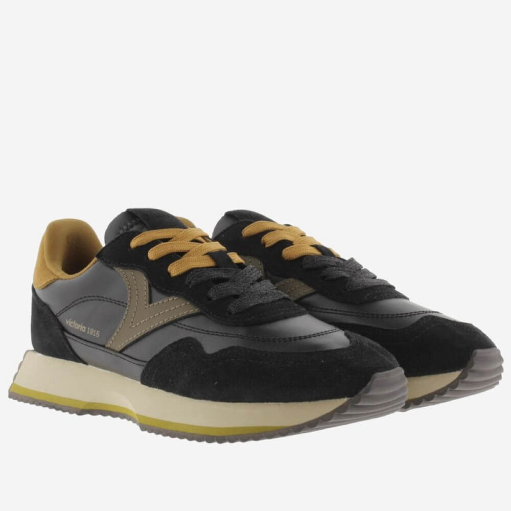 A pair of Victoria vintage-style platform sneakers in black suede and grey leather with mustard yellow laces, lining, and midsole accent, shown against a plain light grey background.