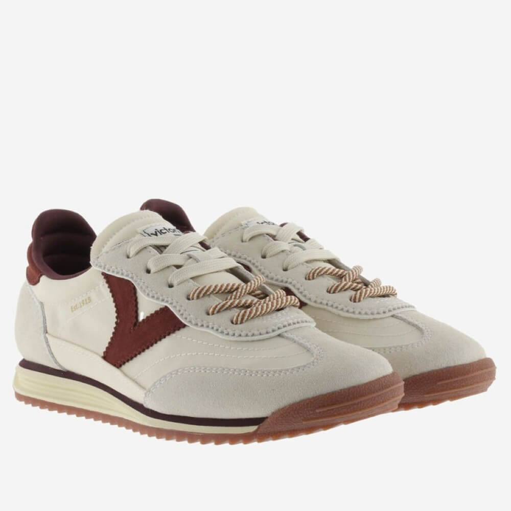 A pair Victoria of vintage-style low-top sneakers in off-white suede and leather, featuring a dark burgundy side stripe, burgundy heel lining, and brown rope laces, set against a plain light grey background.