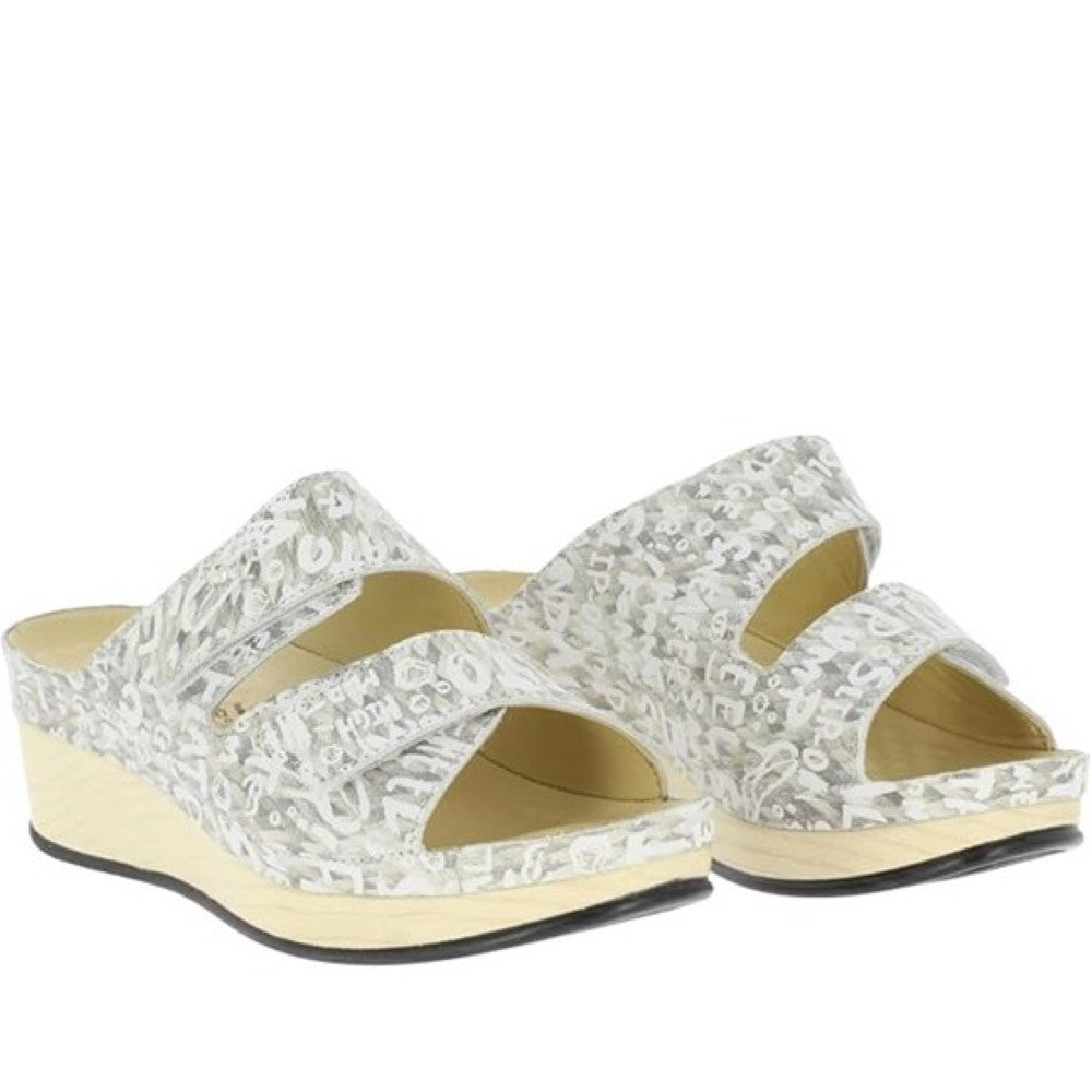 Pair of Vital cream sandals with a wedge sole on a white background