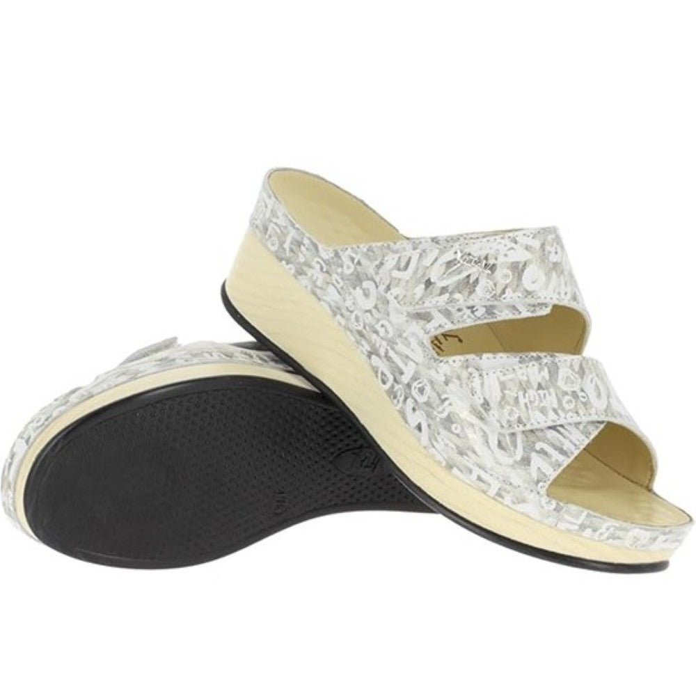 Pair of Vital cream sandals with a wedge sole on a white background