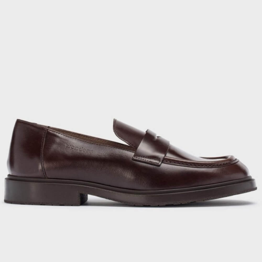 Brown leather loafer shoe on a white background