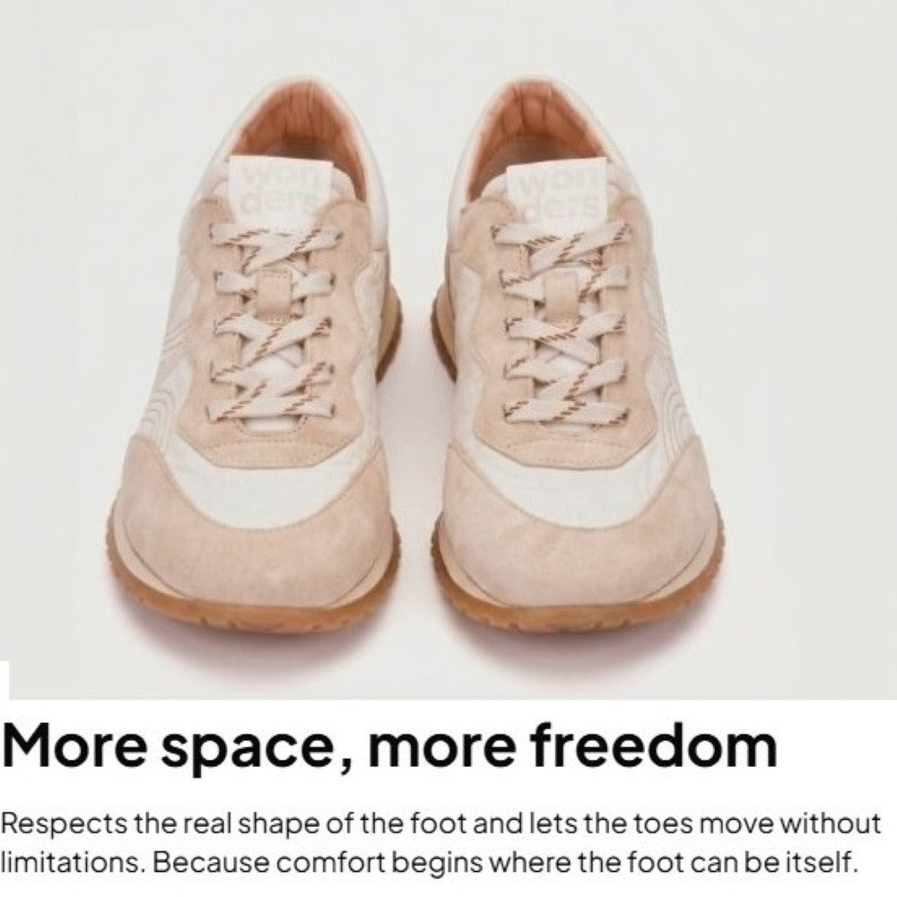 Pair of beige sneakers on a white background with text about comfort and freedom.
