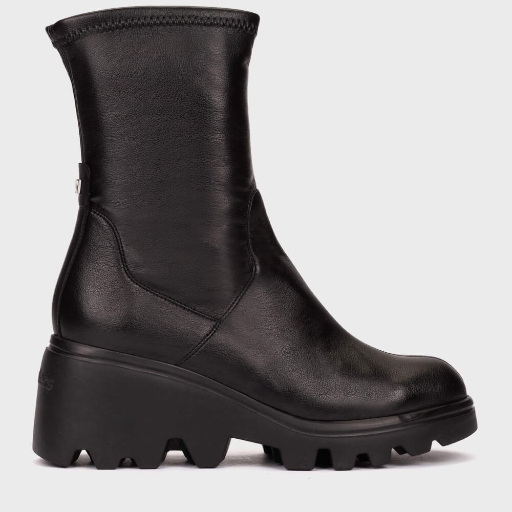 A Wonders black leather ankle boot with a chunky lug sole, shown from a side profile view against a light grey background.