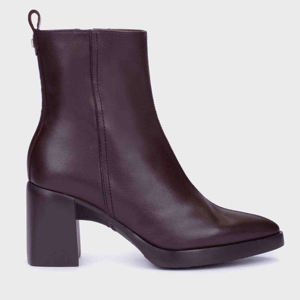 A Wonders dark brown leather ankle boot with a chunky block heel and a pull tab at the back, shown from a side profile on a light gray background.