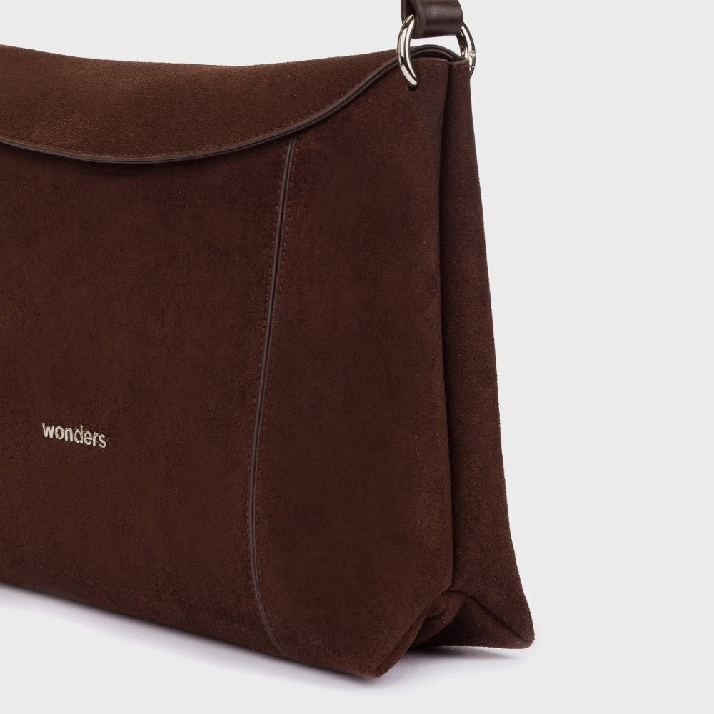 A brown suede effect messenger bag with a flap closure, a matching shoulder strap, and the brand name 'wonders' printed in white on the front, set against a plain light grey background.