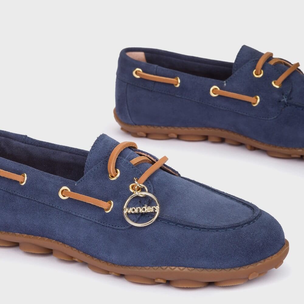 wonders navy Blue loafer boat shoe with brown accents on a white background
