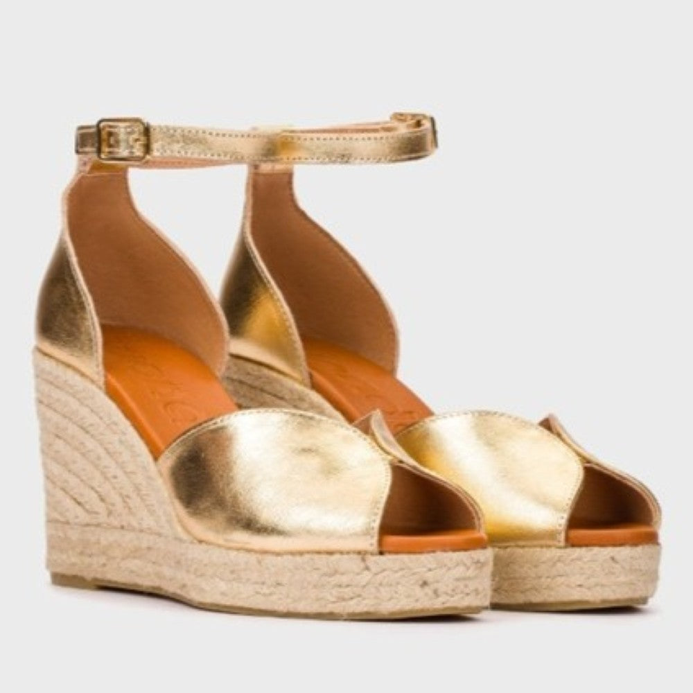 Wonders Gold wedge sandal with espadrille sole on a light gray background