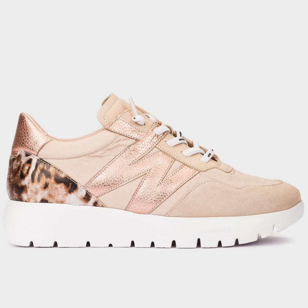 Beige sneaker with leopard print accents on a light gray background