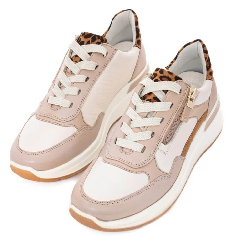 Pair of beige and white sneakers with leopard print accents on a white background