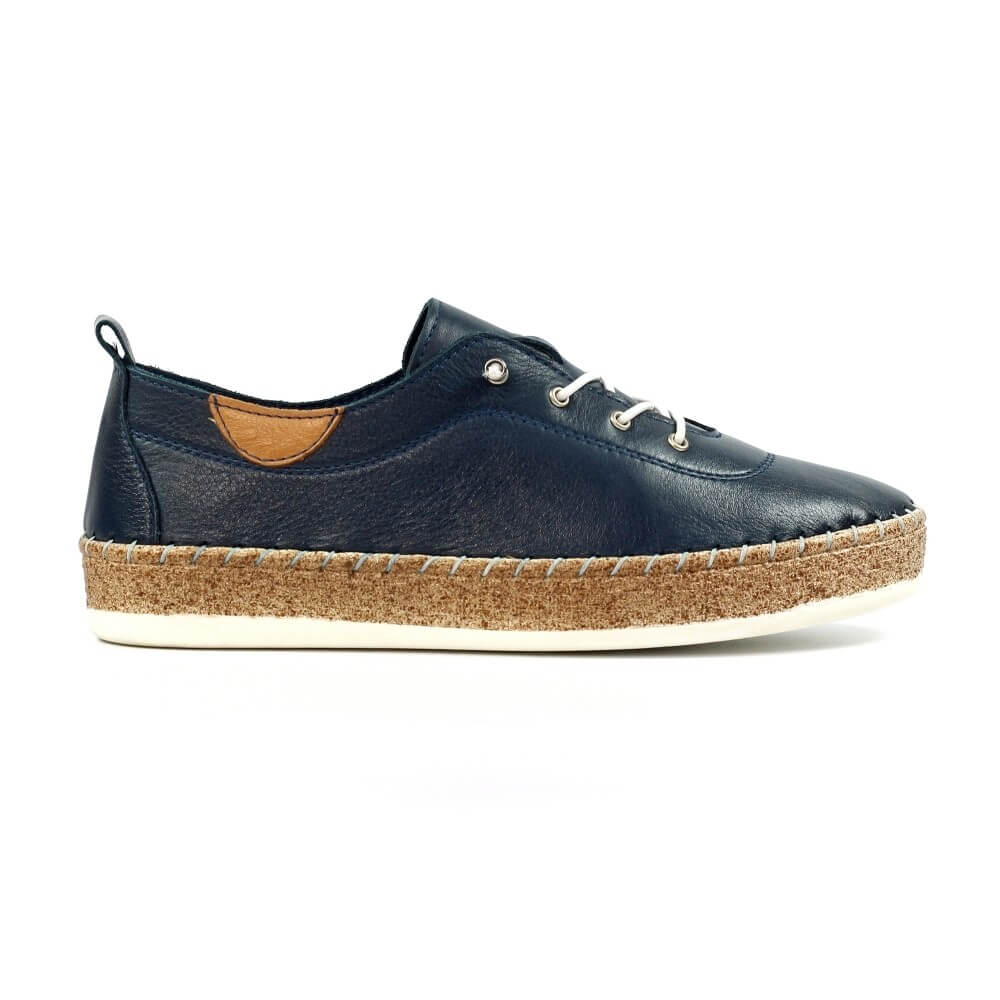 Navy leather shoe with cork sole on a white background