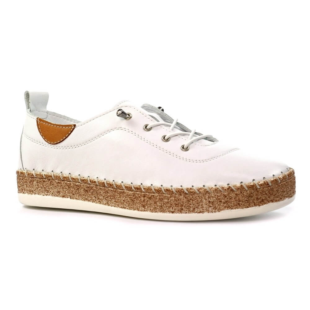 White sneaker with brown sole on a white background