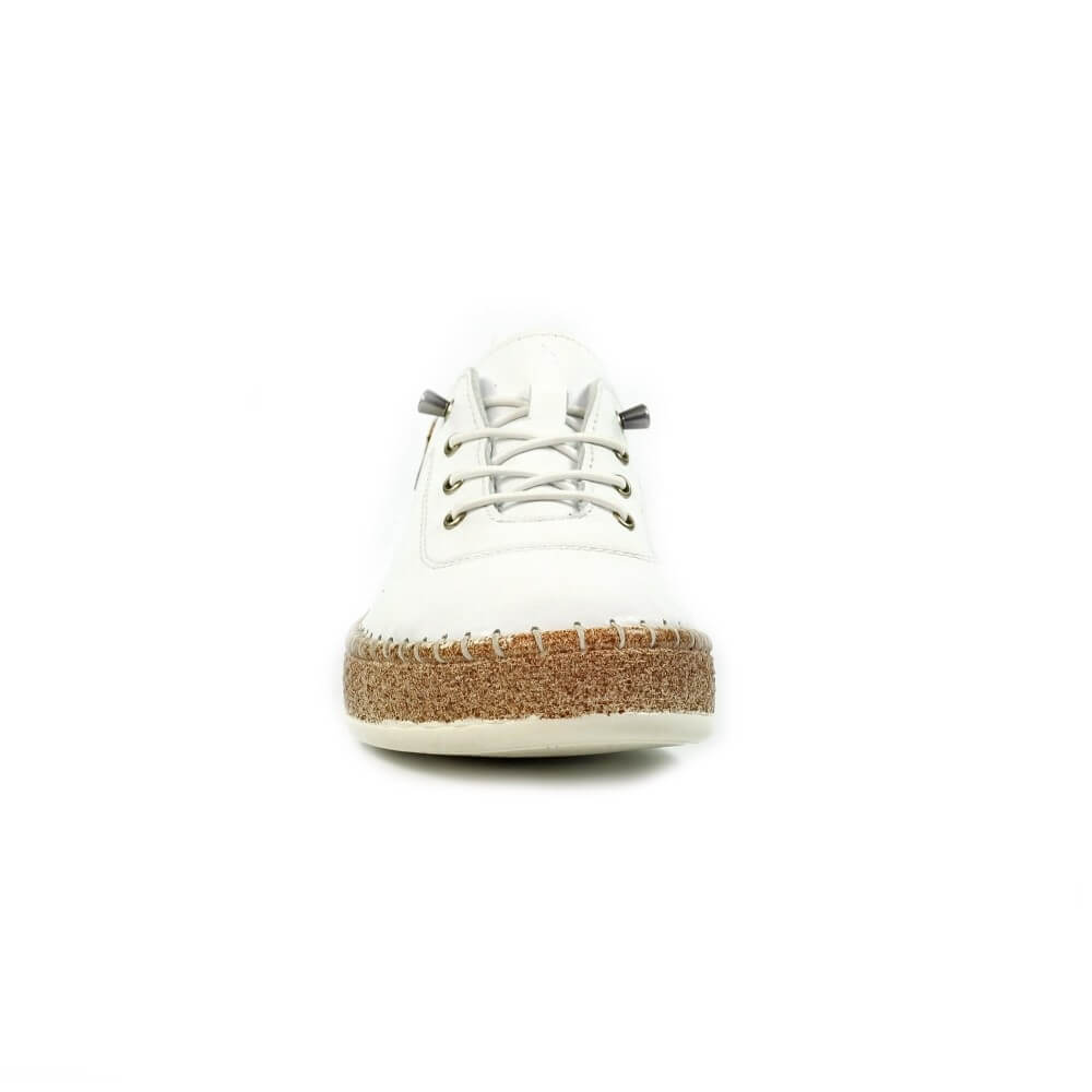 White sneaker with a brown sole on a white background