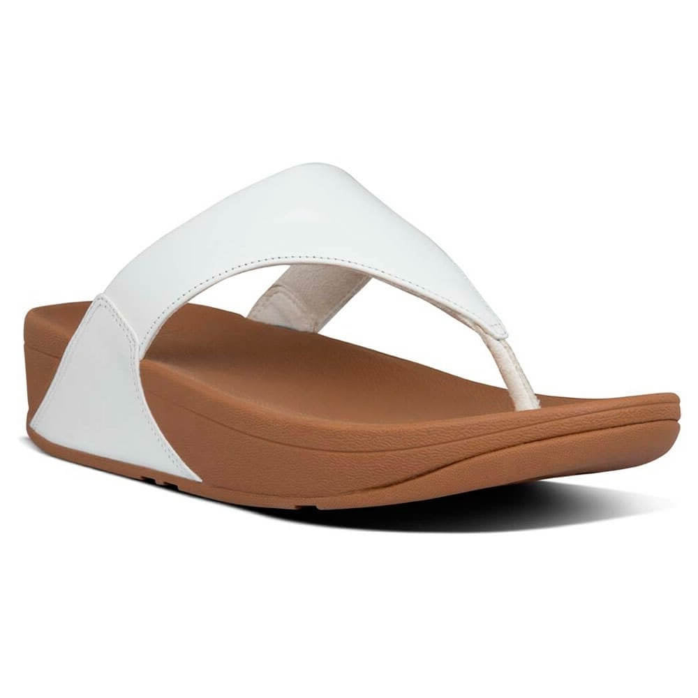 A white leather Fitflop sandal with a simple design and a brown sole.