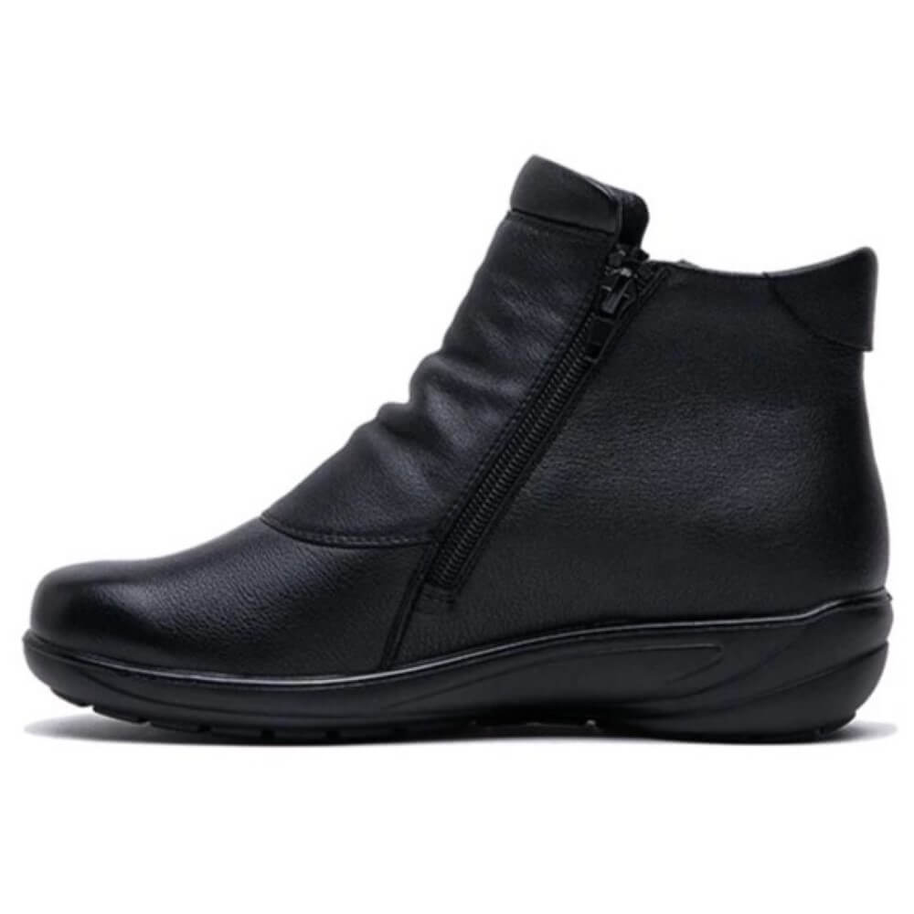 Black leather ankle boot with two zippers on the side, featuring a low heel and round toe.