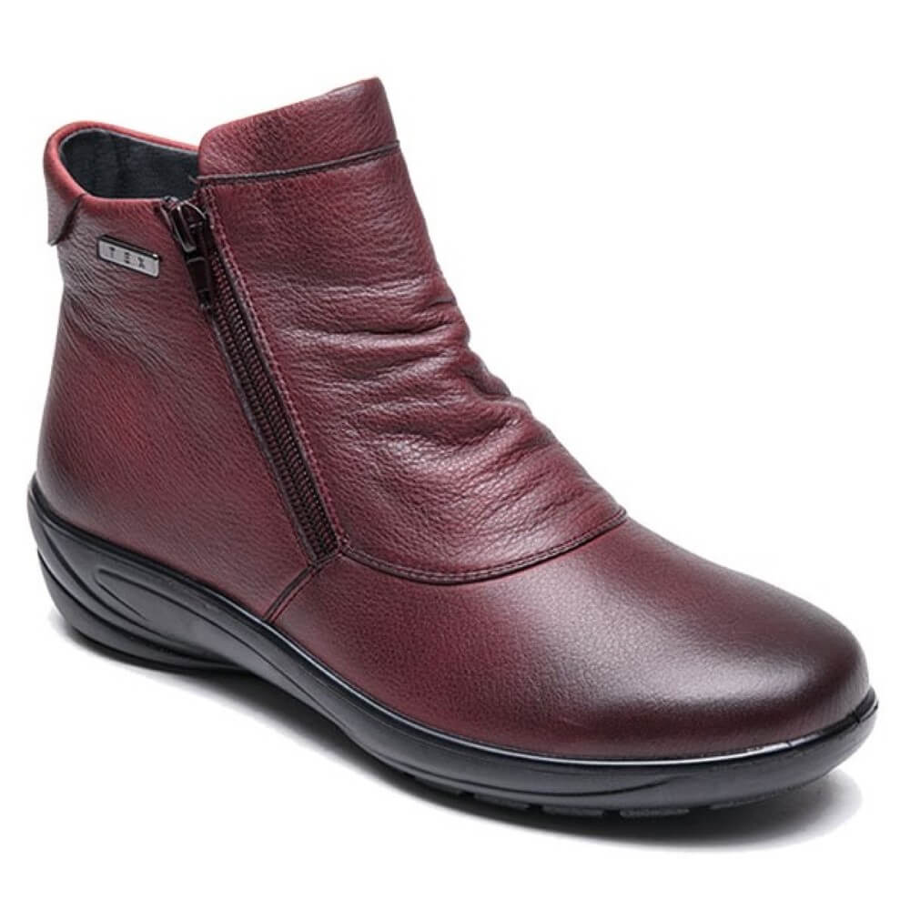 A bordeaux red Nappa leather ankle boot with two vertical zippers on the side.