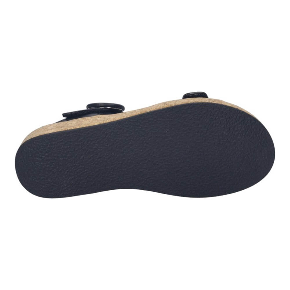 Black sole of a shoe with beige insole on a white background