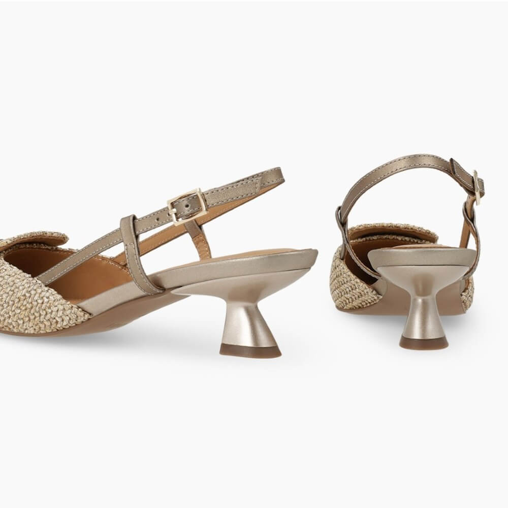 Pair of Lodi beige high-heeled shoes with unique heel designs on a white background