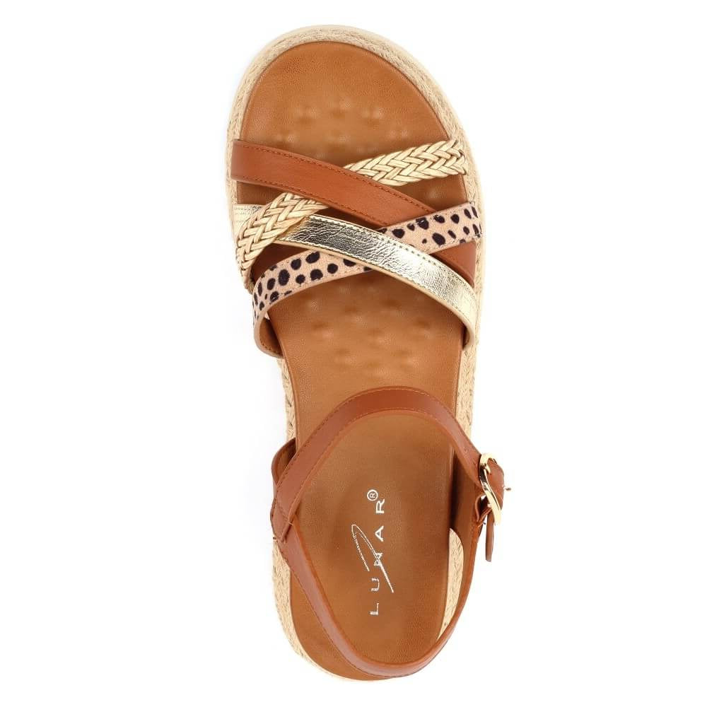 Brown sandal with multiple straps on a white background