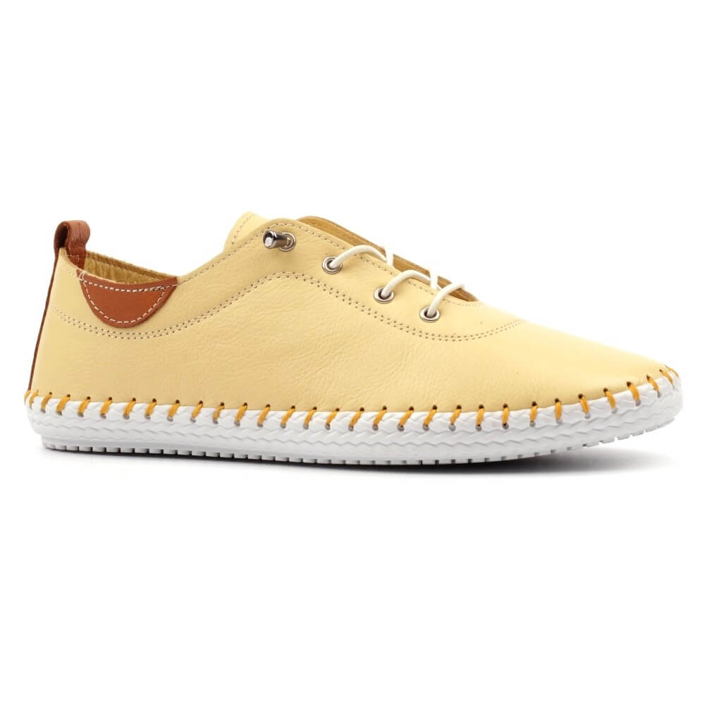 Yellow casual shoe with white sole on a white background