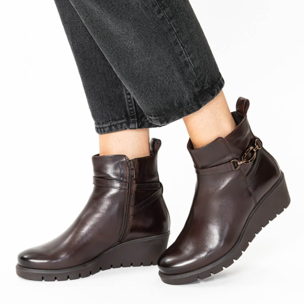Brown ankle boots worn with black jeans on a white background Ara Como Wedge Ankle Boots H-Fit 12-57002 Cacao Brown
