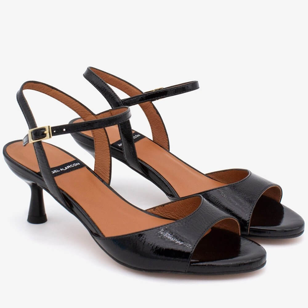 Angel Alacron Black high-heeled sandals with brown insoles on a white background
