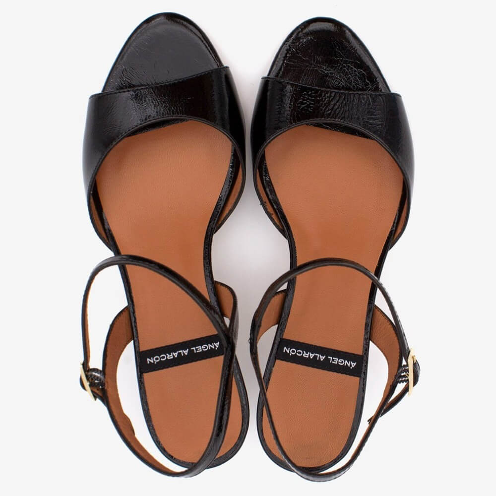 Angel Alacron Black high-heeled sandals with brown insoles on a white background