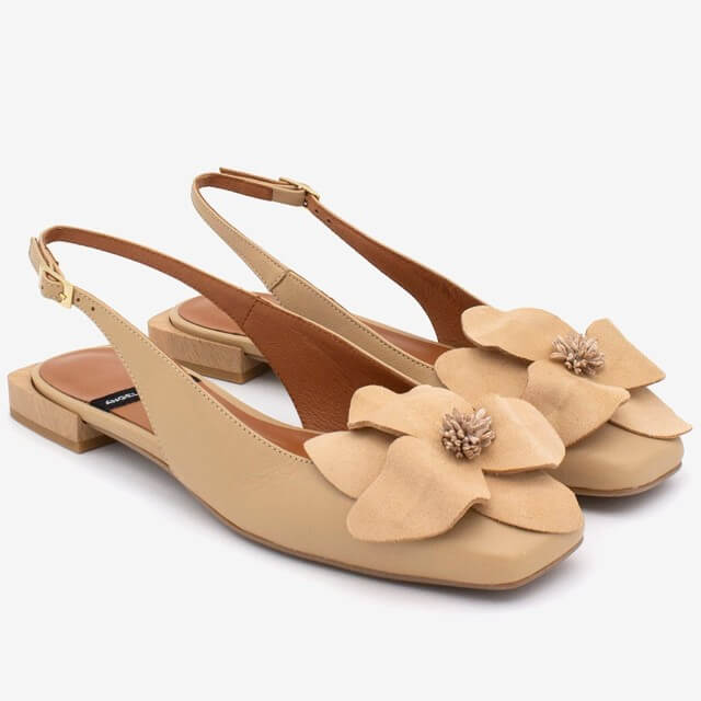 Angel Alarcon Beige sandals with floral decorations on a white background