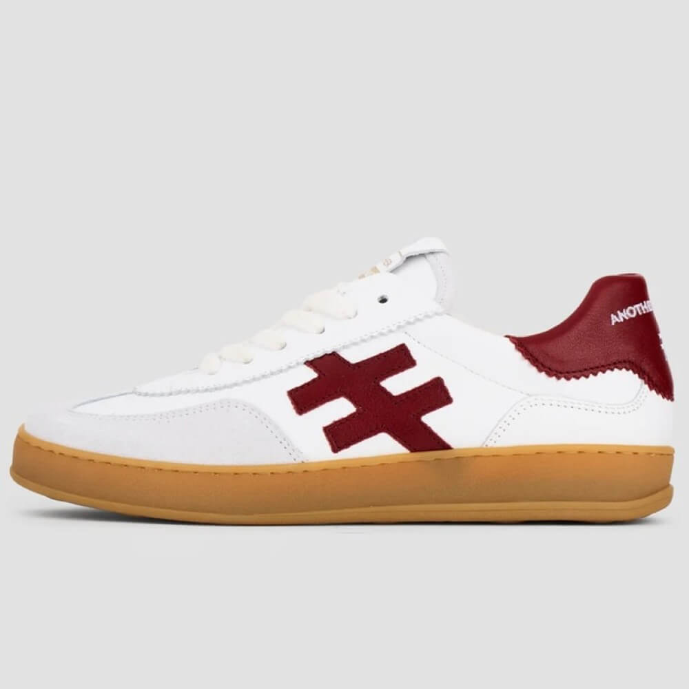 White sneaker with red logo and brown sole on a light gray background Another Trend Leather Sneakers A032-WHITE RED
