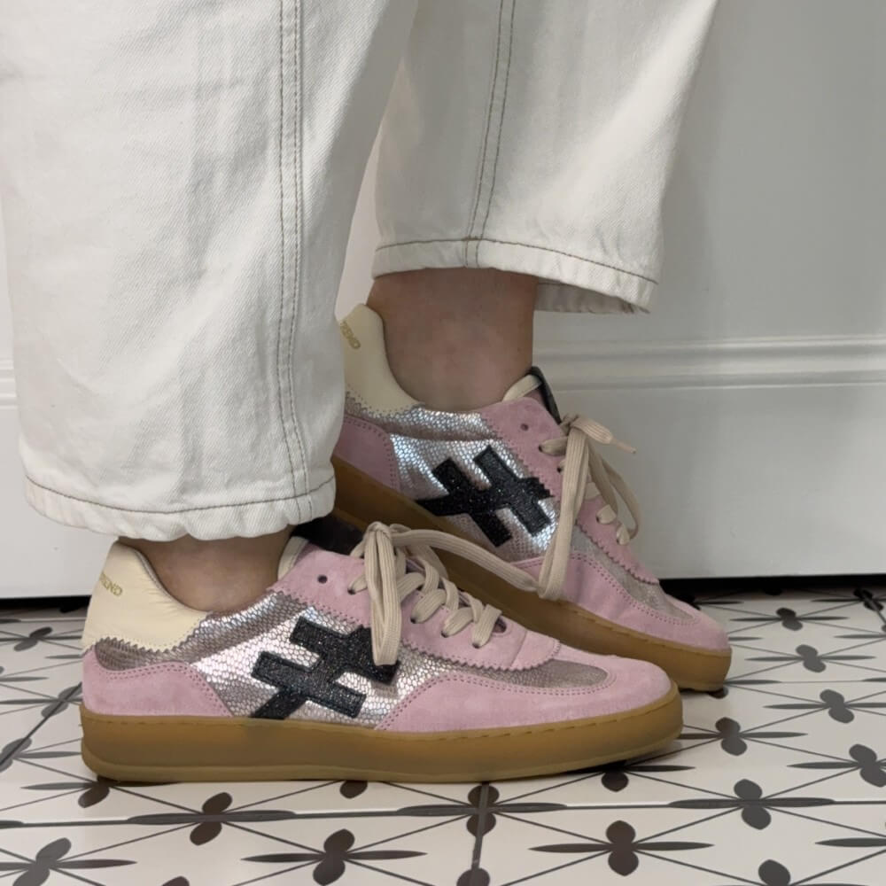 another trend Pink and beige sneakers with a gum sole worn indoors on a tiled floor.