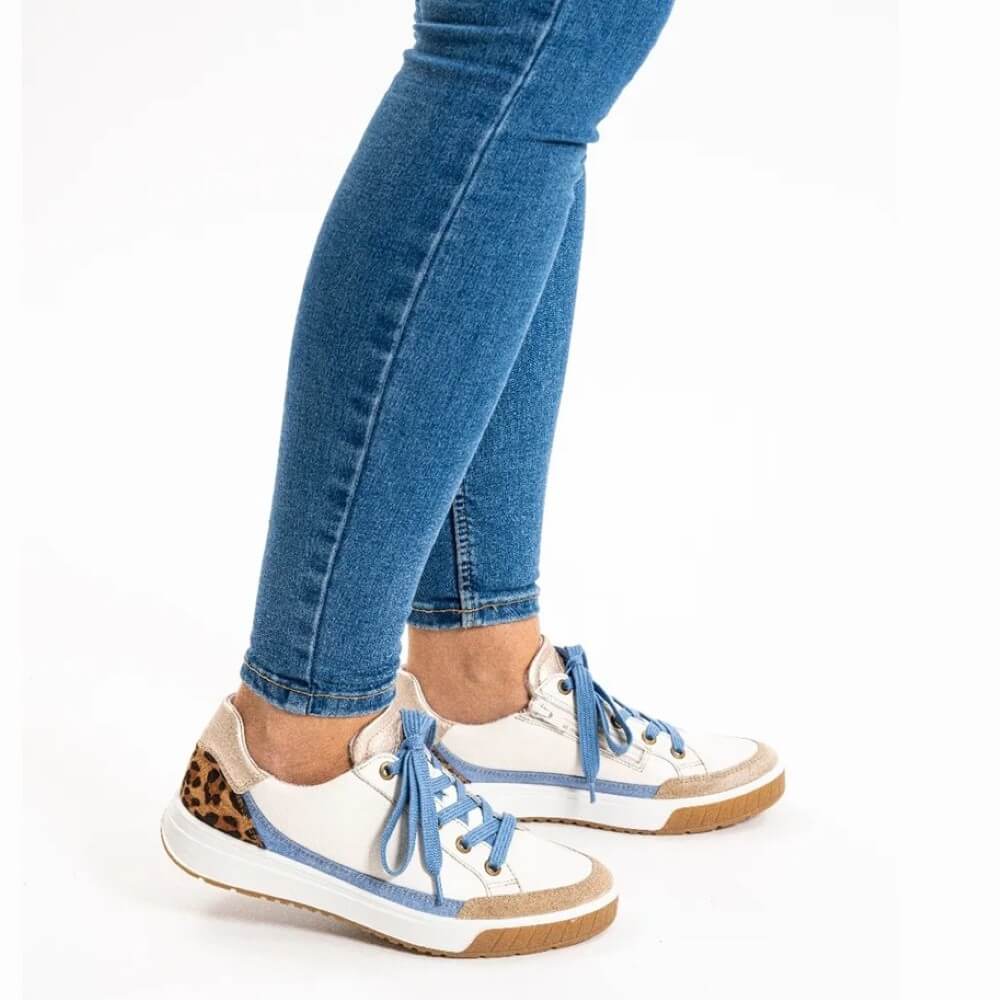 Ara Rom White sneakers with blue laces and leopard print accents worn with blue jeans on a white background