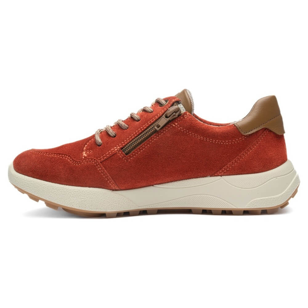 A side-profile view of an ara low-top sneaker in rust red suede, featuring a tan leather heel tab, matching laces, an inside side zipper, and a thick cream-colored midsole.