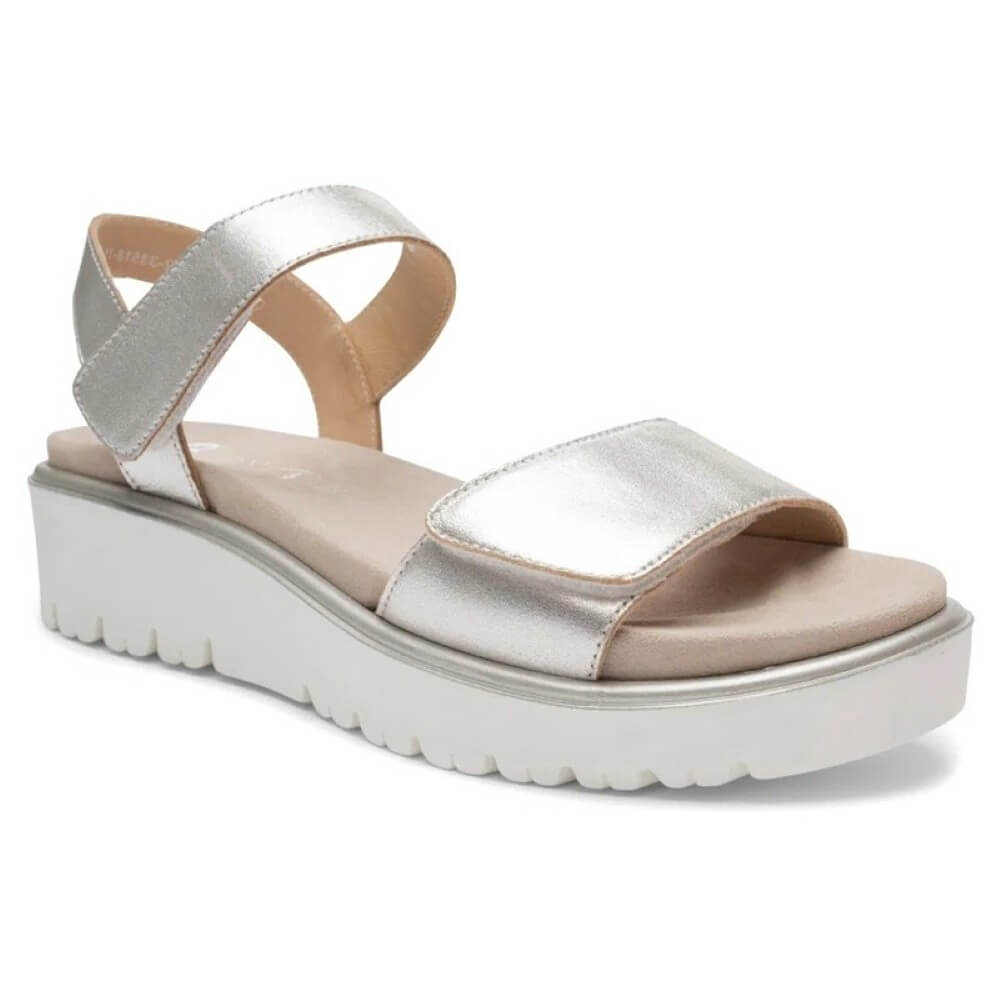 Ara Gold sandal with a platform sole on a white background