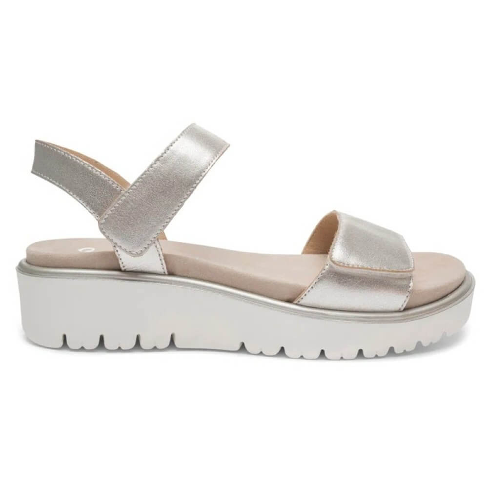 Ara Gold sandal with a platform sole on a white background