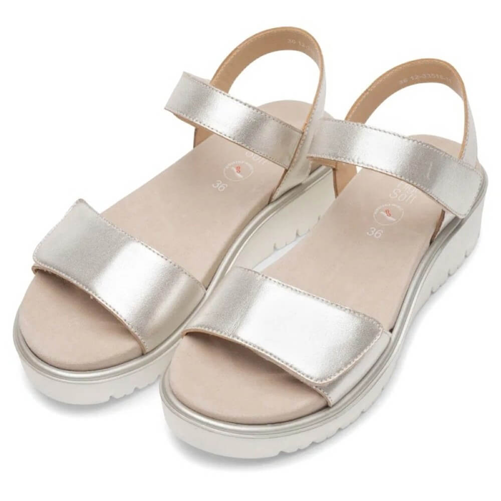 Ara Gold sandal with a platform sole on a white background
