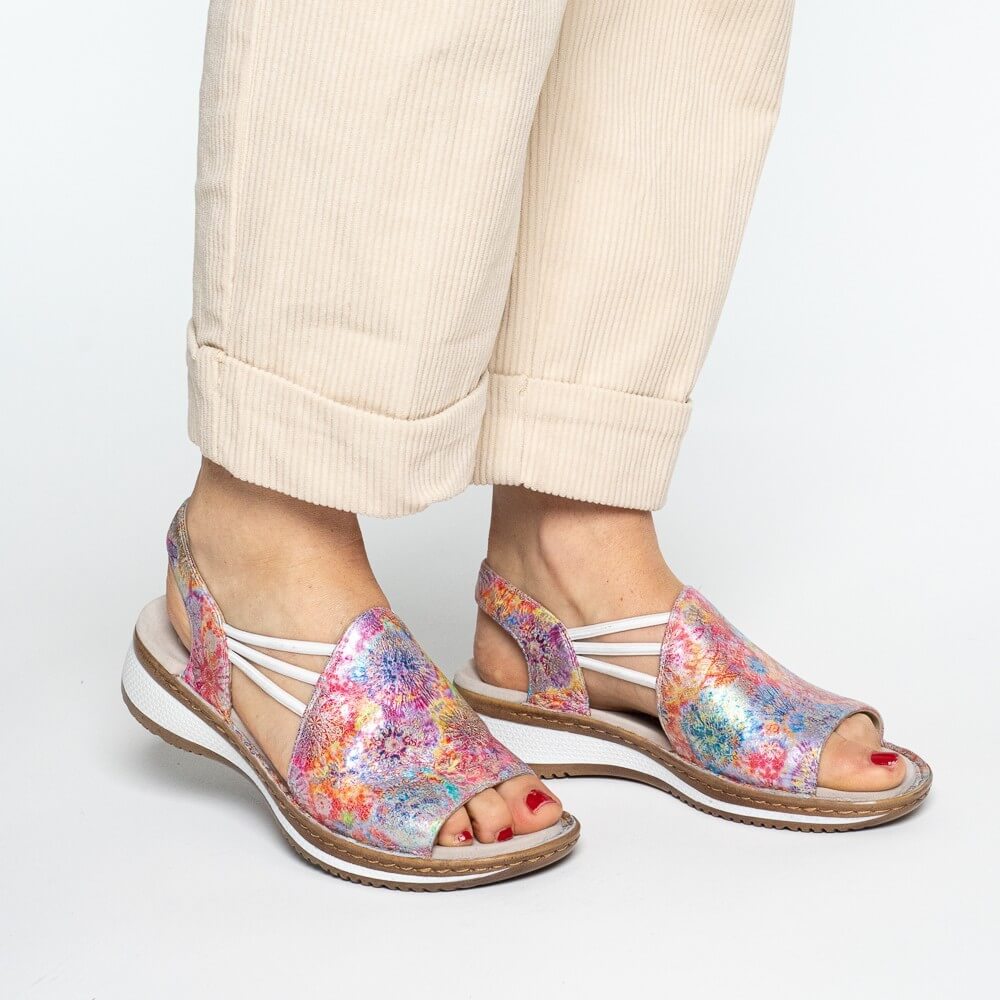 ara Multicolored floral sandals worn with beige pants on a white background