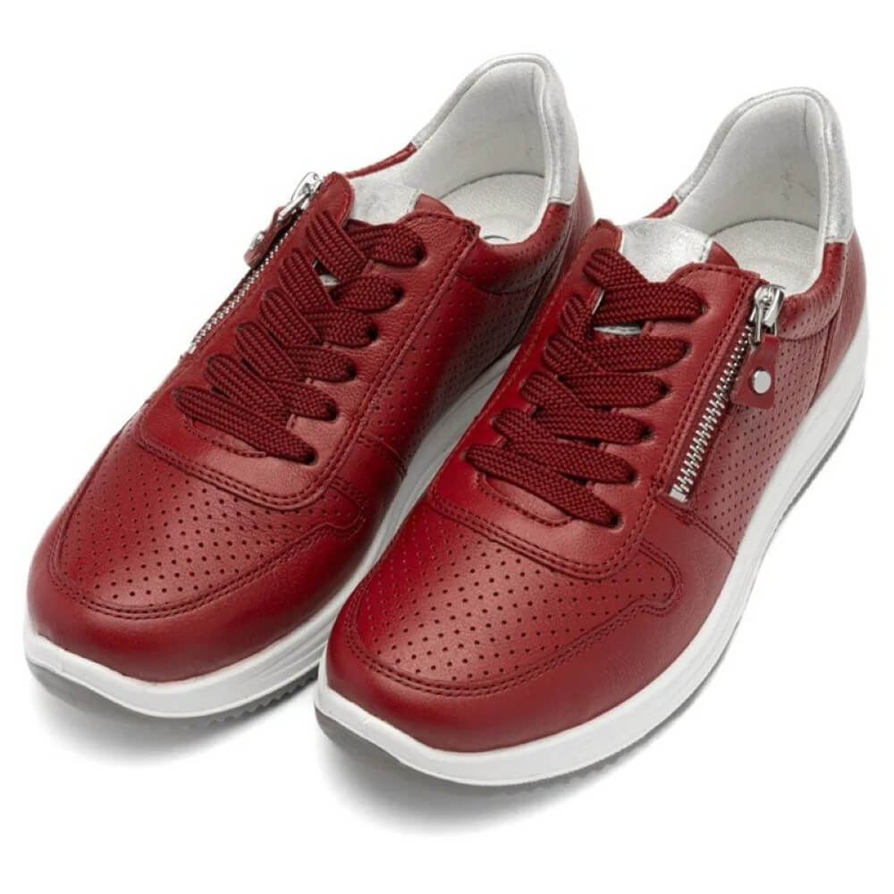 Red sneakers with white soles on a white background