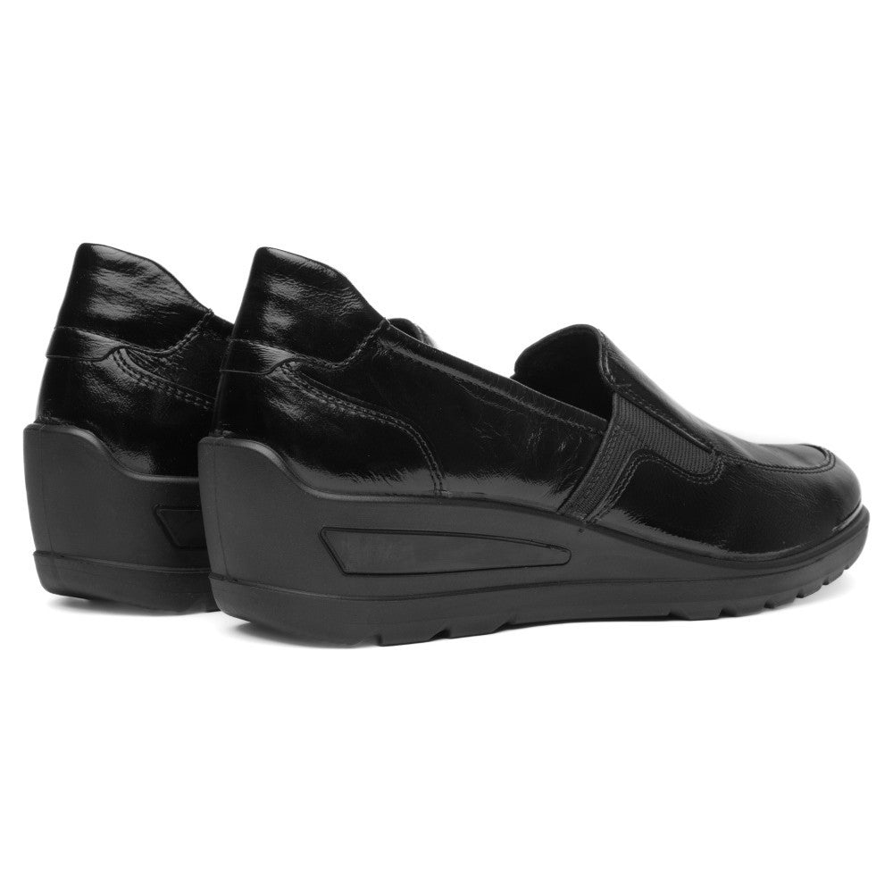 A pair of ara black leather slip-on loafers with a glossy finish, displayed on a clean white background.