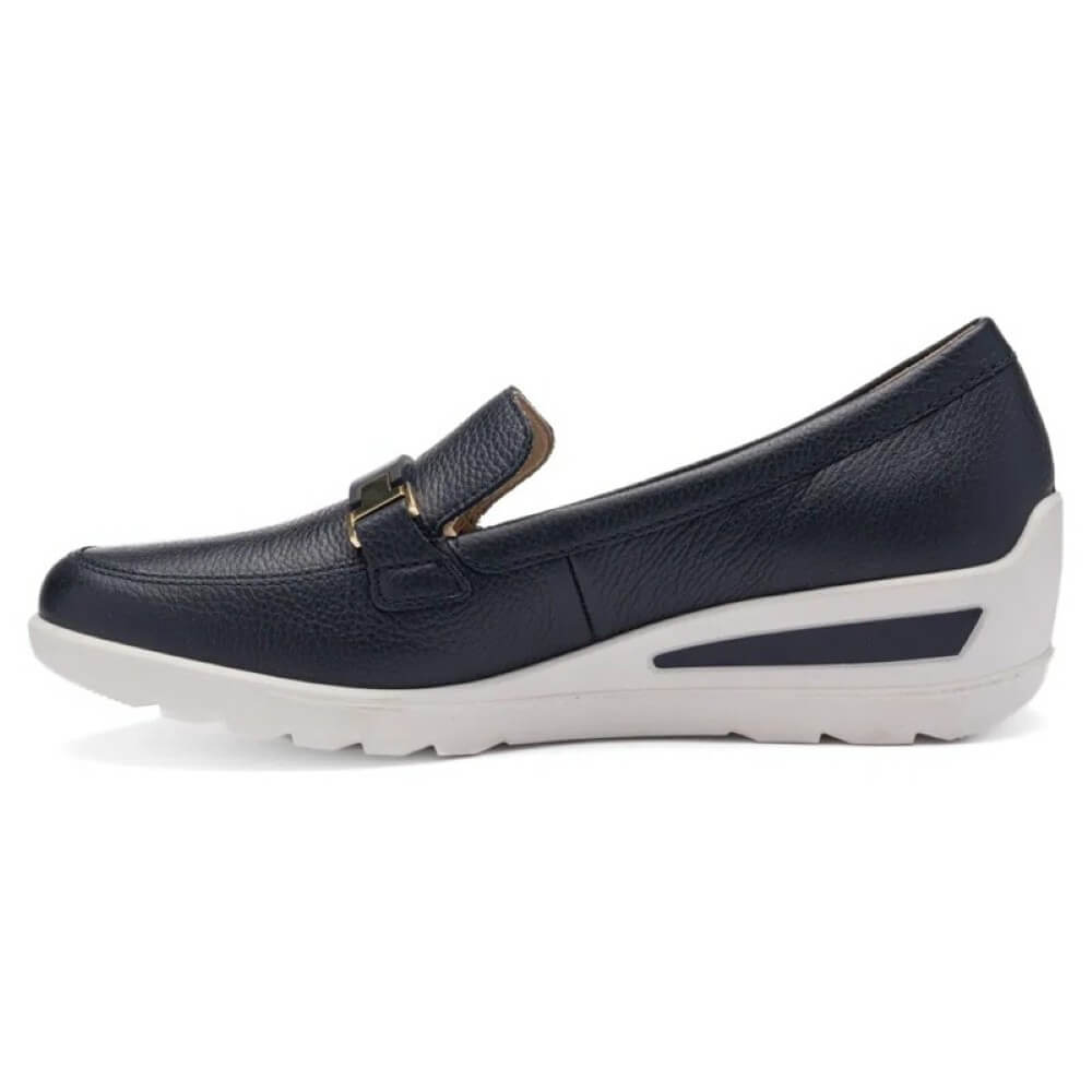 Navy loafer shoe with white sole on a white background