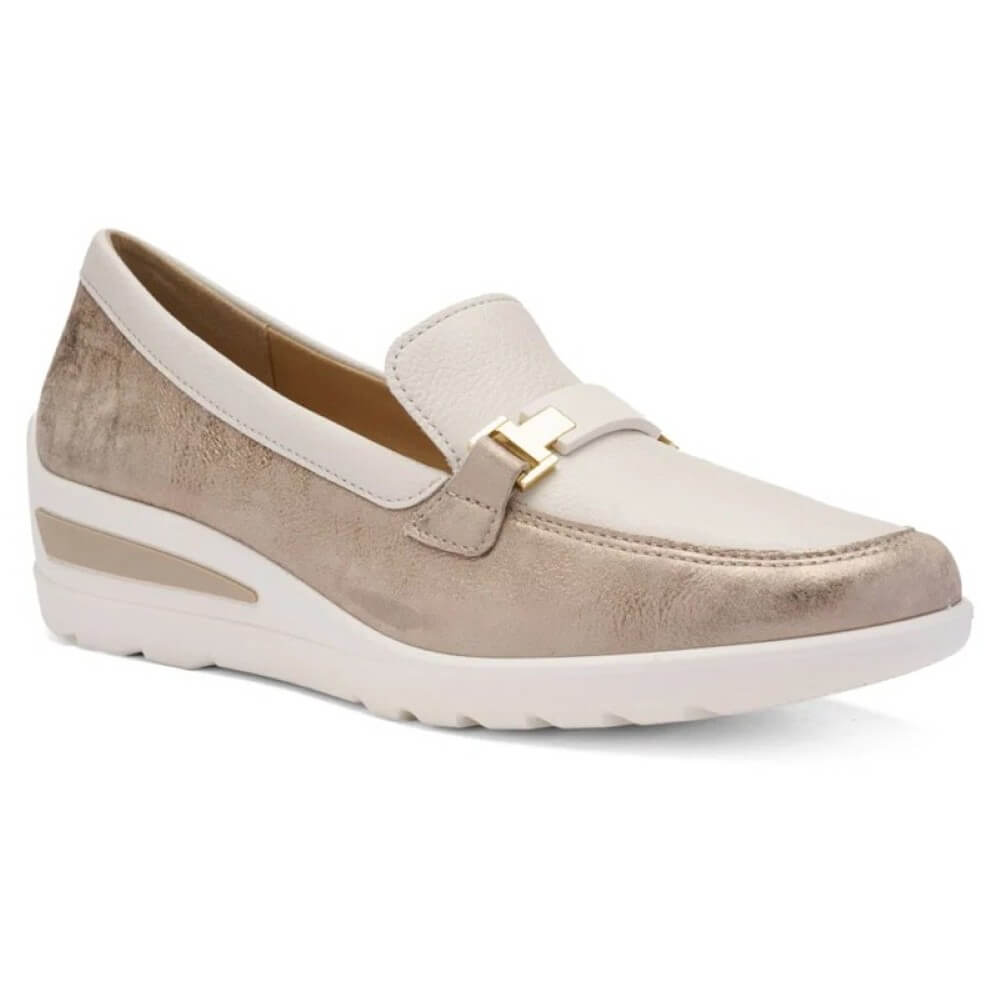 Beige loafer shoe with gold buckle on a white background