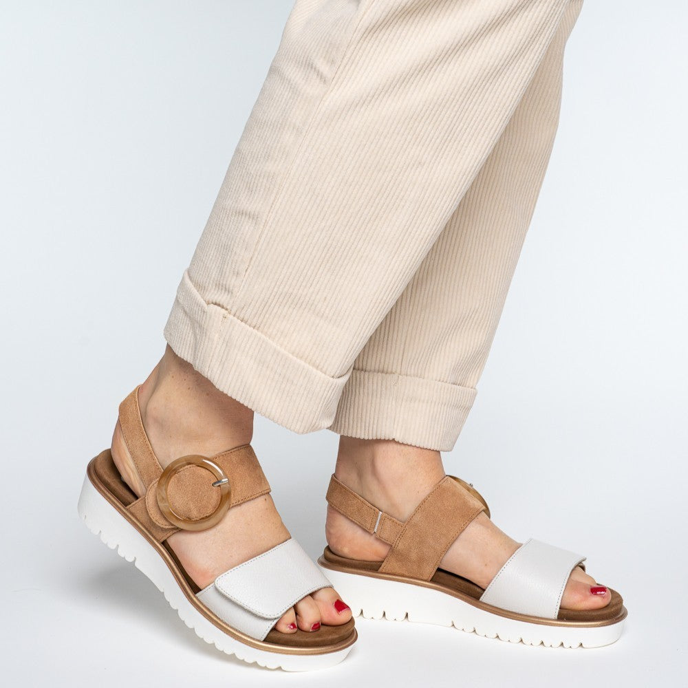 ara white and tan sandals worn with beige trousers
