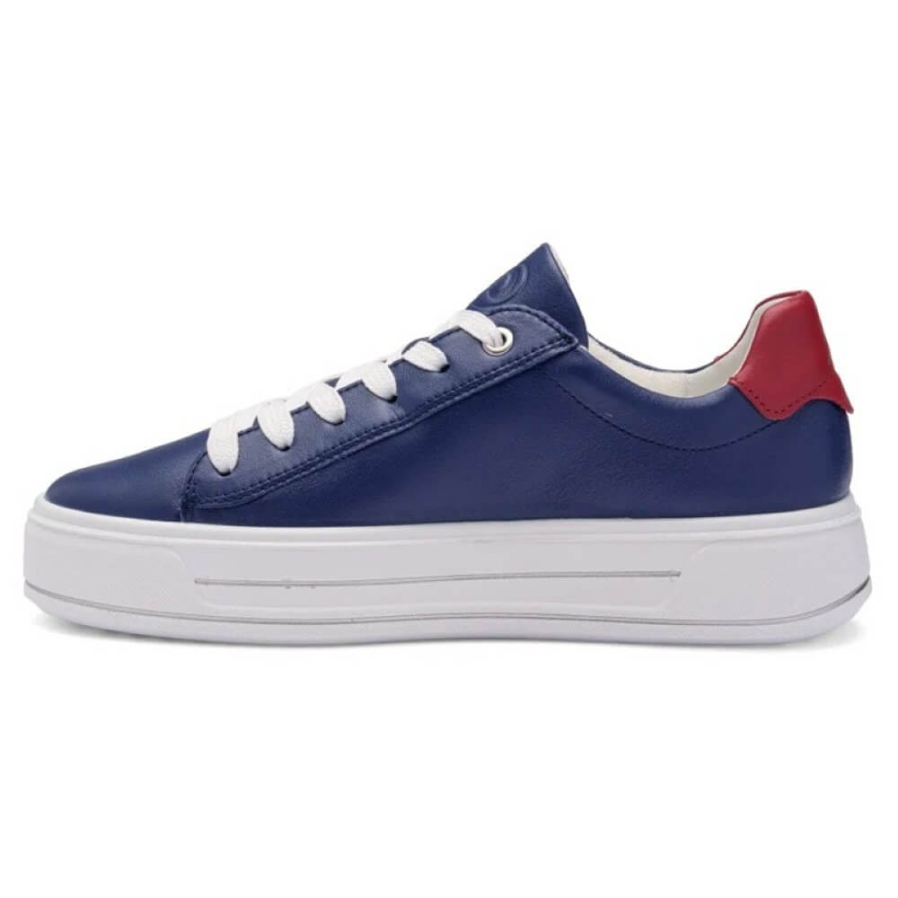 Blue sneaker with white laces and red heel on a white background