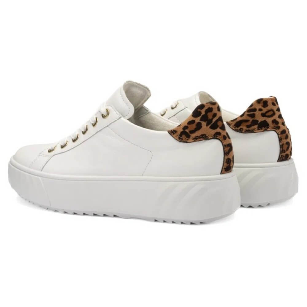 White sneakers with leopard print accents on a white background