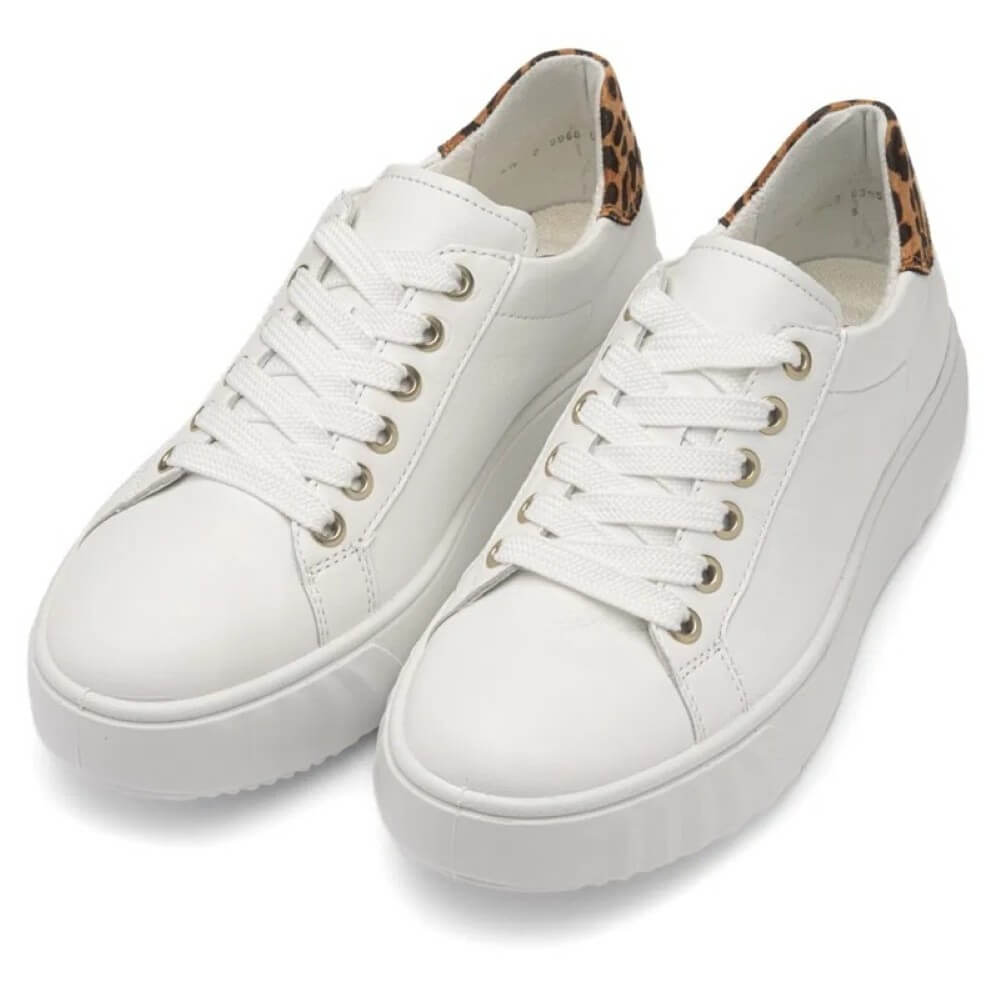 White sneakers with leopard print accents on a white background