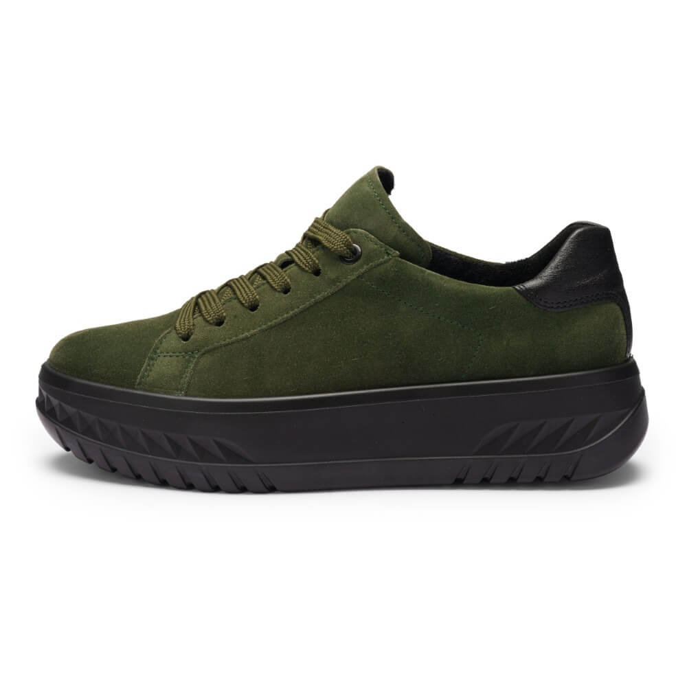 Green sneaker with black sole on a white background