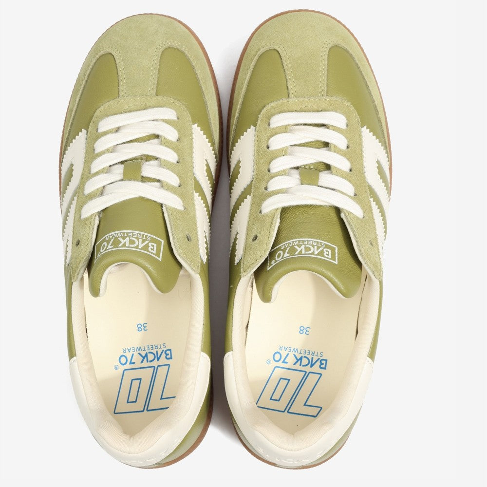 Back 70 Green sneakers with white accents on a white background